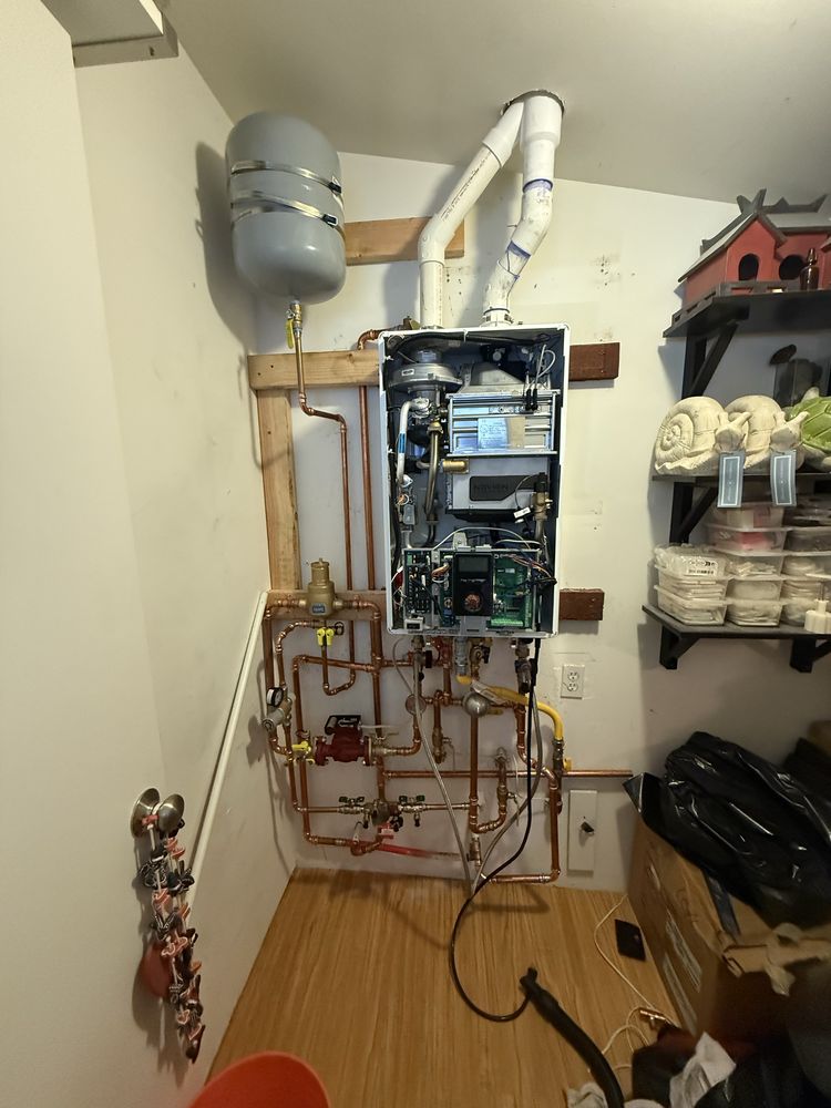 Tankless water heater system professionally installed with copper piping